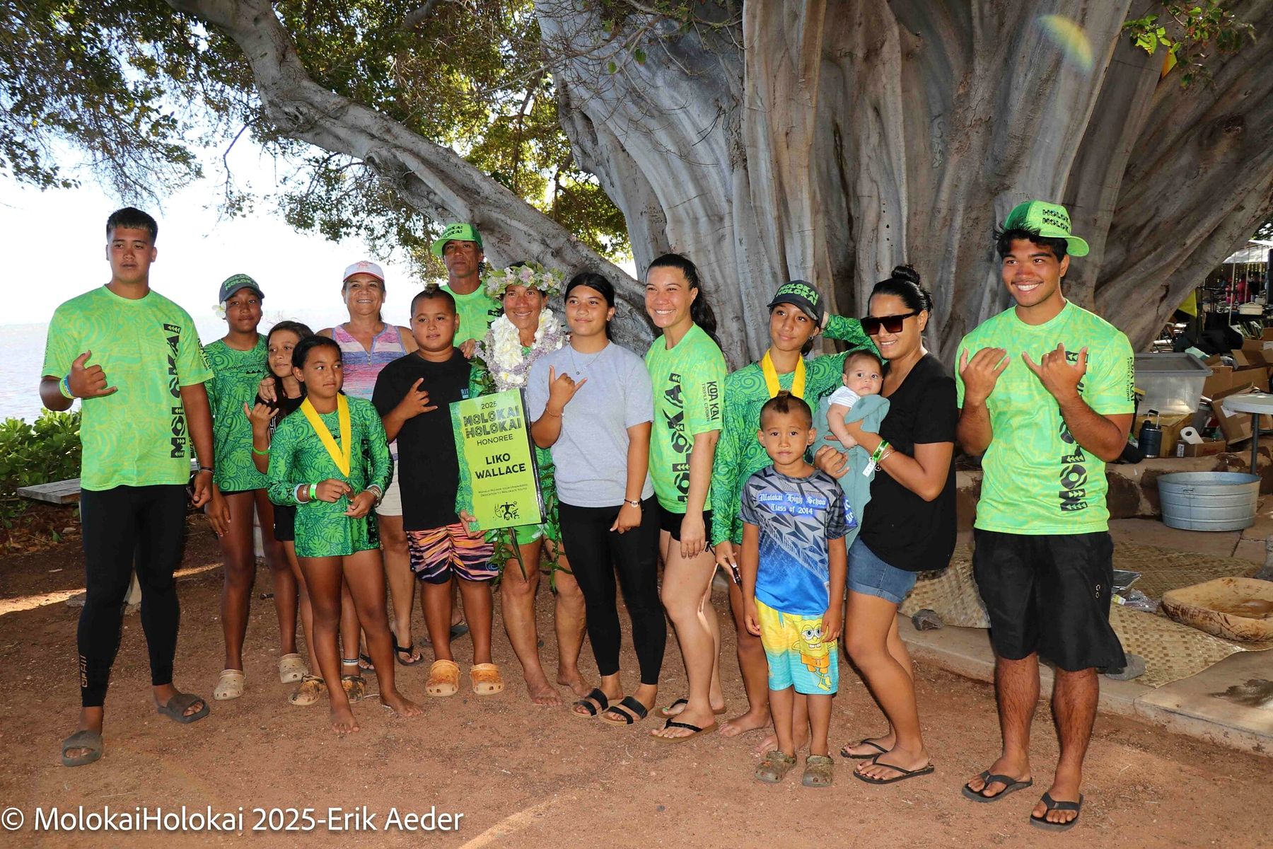 Keiki, parents and kūpuna gather together under the banyan tree